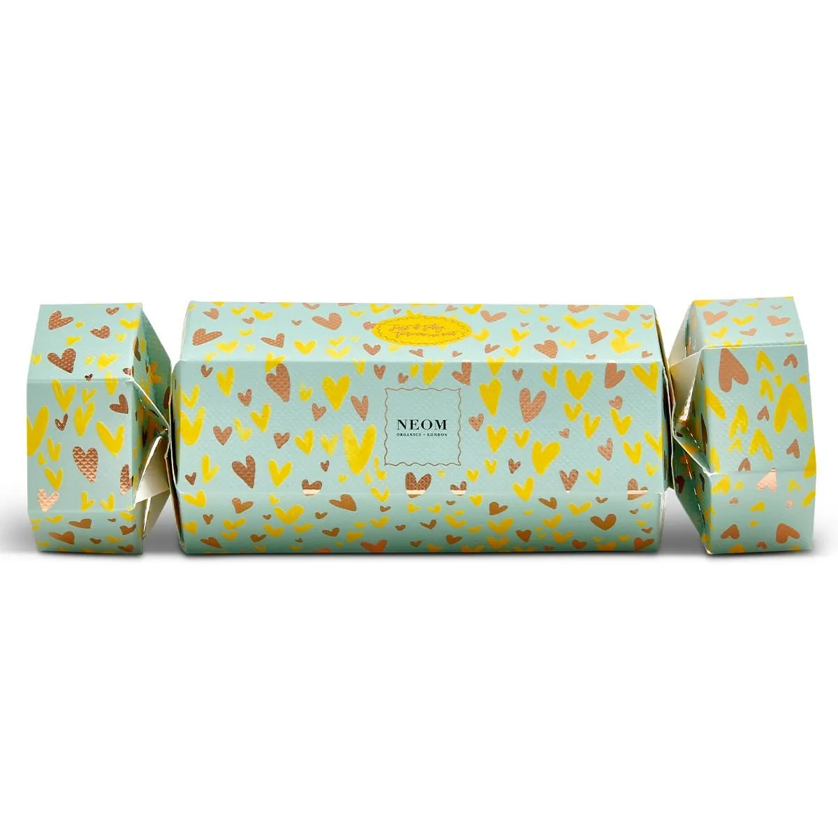 Neom Organics Christmas cracker in pale green, printed with gold and copper hearts