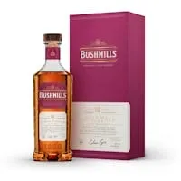 Bushmills 16 Year Old Irish whiskey bottle beside its burgundy presentation box