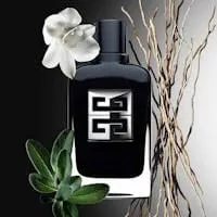 Black Givenchy Gentleman Society fragrance bottle styled with a white orchid and bare branches