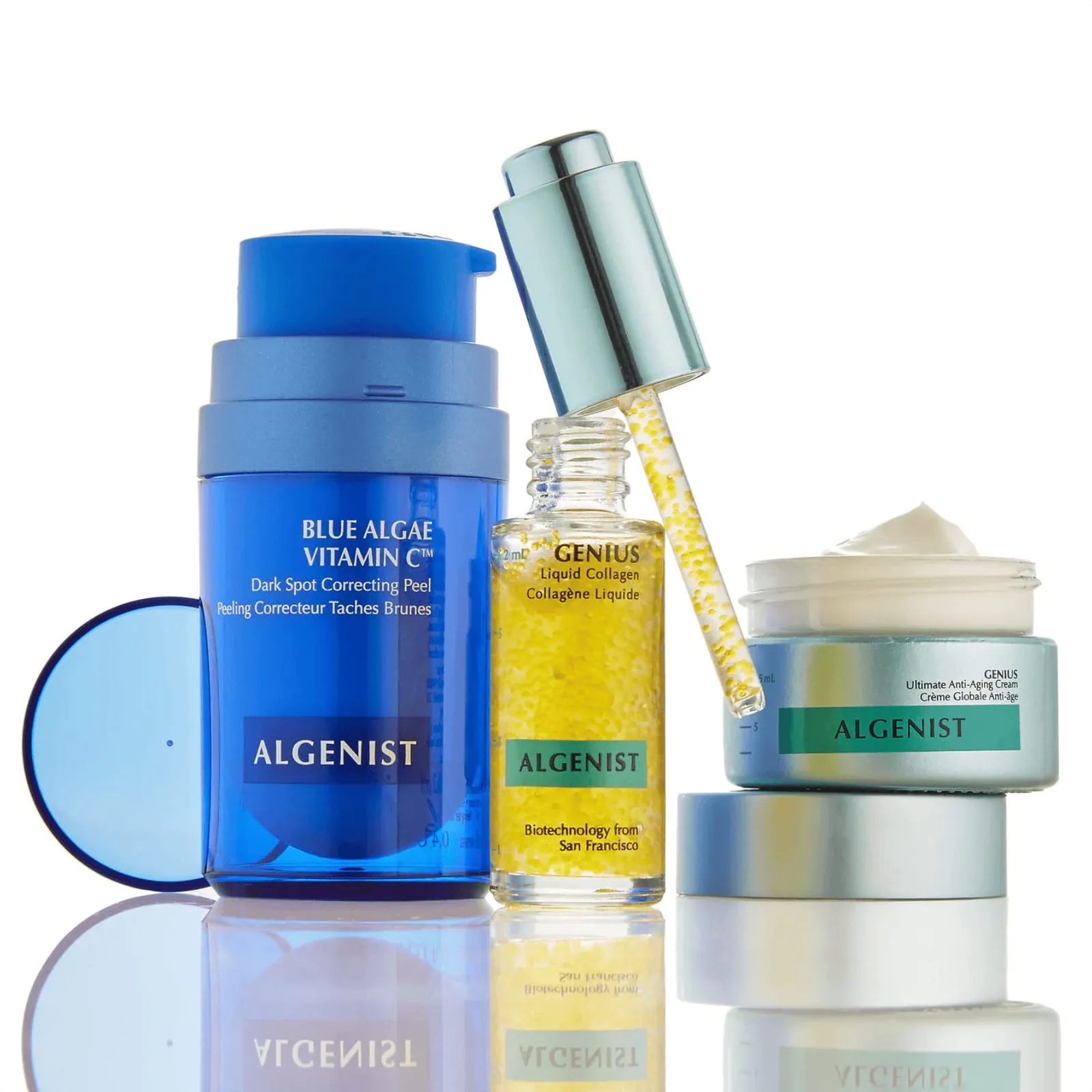 Algenist Blue Algae Vitamin C peel, Genius liquid collagen and anti-ageing cream on a reflective white surface
