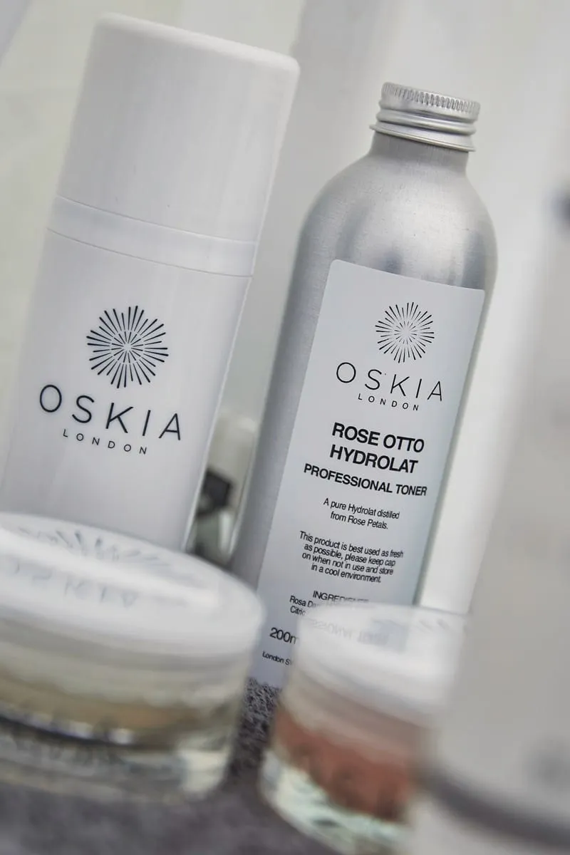 OSKIA London Rose Otto Hydrolat professional toner beside other treatment-room skincare bottles